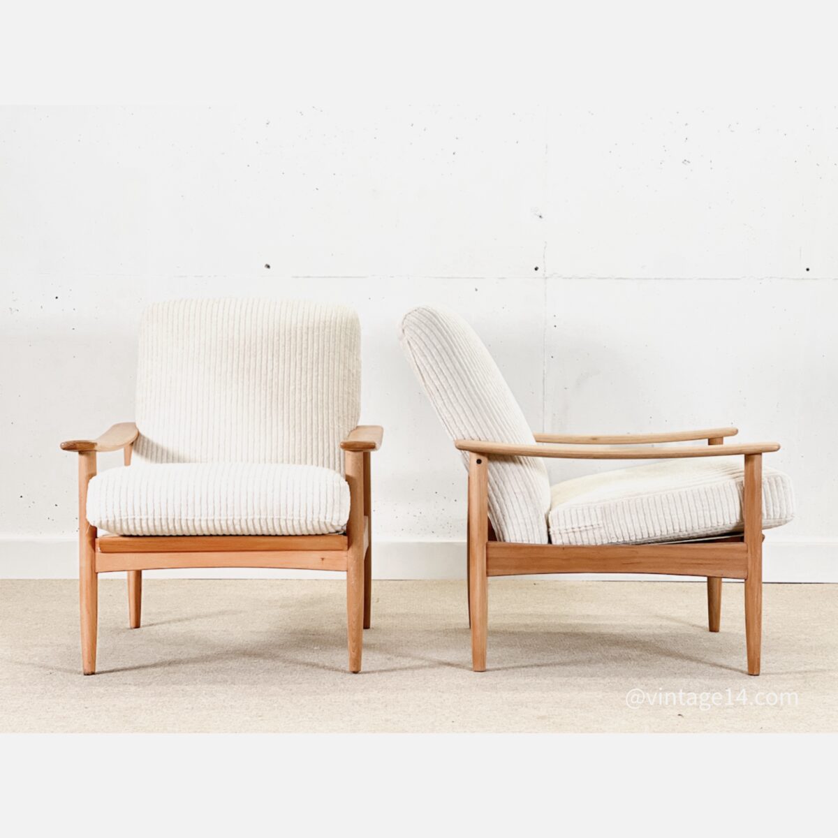A pair of Lounge armchairs (Guy Rogers)